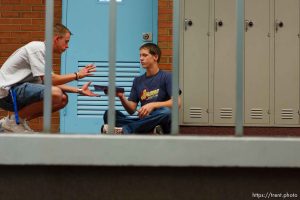 Signing yearbooks at East Carbon High School, David Stewart (left) and Travis Hepworth. The small town of Sunnyside's East Carbon High School is being closed. The students will be transfered to Price's Carbon High School, a 25-minute bus ride away.