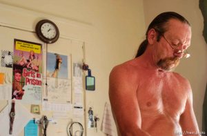 Michael Whiteman, recently paroled after serving eleven years in prison for a murder he claims was self-defense, in his room at Salt Lake City's Regis Hotel. Whiteman is attending paralegal classes at Salt Lake Community College and putting his life back together.