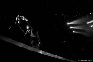 U2 performs at the Delta Center.