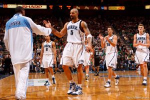 Utah Jazz forward Carlos Boozer (5) high-fives a teammate coming off the floor during a timeout with a 7 point lead. Left to right, Utah Jazz guard Deron Williams (8), Utah Jazz forward Carlos Boozer (5), Utah Jazz center Mehmet Okur (13), of Turkey, Utah Jazz guard Gordan Giricek (10), of Croatia, and Utah Jazz forward Andrei Kirilenko (47), of Russia. Salt Lake City - Utah Jazz vs. San Antonio Spurs, NBA basketball.
