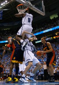 Salt Lake City - Utah Jazz vs. Golden State Warriors, NBA Playoffs basketball, second round, Game Two, at EnergySolutions Arena. Utah Jazz guard Ronnie Brewer (9) dunks and Utah Jazz forward Andrei Kirilenko (47), of Russia, goes under him (sequence)