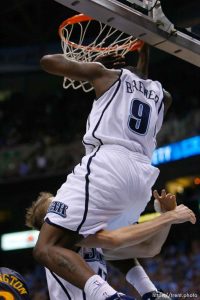 Salt Lake City - Utah Jazz vs. Golden State Warriors, NBA Playoffs basketball, second round, Game Two, at EnergySolutions Arena. Utah Jazz guard Ronnie Brewer (9) dunks and Utah Jazz forward Andrei Kirilenko (47), of Russia, goes under him (sequence)