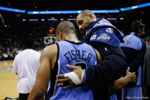 San Antonio - Utah Jazz forward Carlos Boozer (5) puts his arm around teammate Utah Jazz guard Derek Fisher (2) and shares a short conversation in the 4th quarter. Utah Jazz vs. San Antonio Spurs, Western Conference Finals game five at the AT&T Center. 5.30.2007
