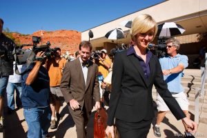 defense attorney Tara Isaacson, Walter Bugden and media. St. George - Warren Jeffs trial. The polygamous sect leader was charged with two counts of rape as an accomplice stemming from a marriage he officiated involving a 14-year-old girl and her 19-year-old cousin.