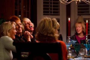 Salt Lake City - Members of the Blue Thong Society's Park City chapter trade jokes over dinner. Left to right: Nancy Ramaley, Nancy Haga, Debra Harris, Deanna Colaizzi (back to camera) and Cheryl Leonard. The Blue Thong Society is the Baby Boomers' alternative to the Red Hat Society. Their mission is to 