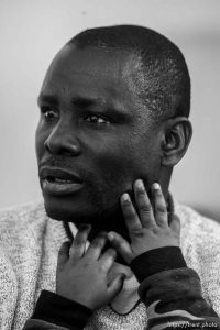 Salt Lake City - Etienne Barabiraho is a refugee from Burundi, and a single parent who now lives in Salt Lake City with his four children. With his 3 1/2 year old son Iranzi Beatrice at right, Barabiraho told his story Tuesday, December 18, 2007.