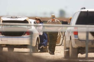 Eldorado - Young FLDS woman with baby arriving at civic center during raid on the FLDS YFZ 