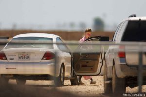 Eldorado - Young FLDS woman leaving civic center in small car during raid on the FLDS YFZ 