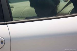 Eldorado - Young FLDS woman leaving civic center in small car during raid on the FLDS YFZ 