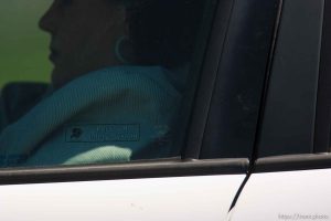 Eldorado - Young FLDS woman leaving civic center in small car during raid on the FLDS YFZ 