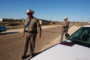 Eldorado - Texas State Troopers Sgt. Stan Waters (fur collar) and Martin Molotsky manning a roadblock on road CR-300, which leads to the FLDS YFZ 