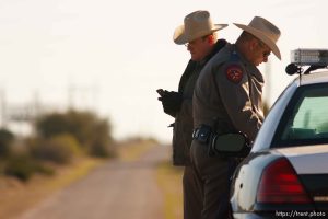 Eldorado - Texas State Troopers Sgt. Stan Waters (left) and Martin Molotsky manning a roadblock on road CR-300, which leads to the FLDS YFZ 