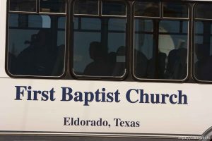 Eldorado - First Baptist Church bus coming out on CR-300 during raid on the FLDS YFZ 