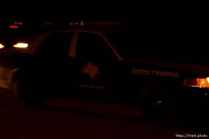 Eldorado - Official vehicles on CR-300 the night Texas law enforcement breaches and searches the building on the YFZ Ranch outside of Eldorado, Texas. 04.05.2008