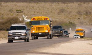 Eldorado - School buses carrying FLDS members taken from the YFZ Ranch on their way to Fort Concho in San Angelo, under police escort