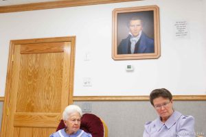 Marianne, an FLDS woman on the YFZ Ranch Wednesday, April 16, 2008, tells the story of being taken with her four daughters in the raid. Above her is a portrait of Joseph Smith, which both the polygamous FLDS and mainstream LDS church revere as a founding prophet.