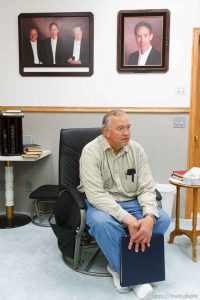 Lamar Johnson in his home on the YFZ Ranch Wednesday, April 16, 2008, talks about his children, taken in the raid. On the wall are portraits of FLDS leaders Warren Jeffs, Wendell Nielsen and Fred Jessop.