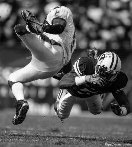 Provo - BYU vs. Wyoming college football, Saturday, September 20, 2008, at BYU's Edwards Stadium. BYU defensive back Brandon Bradley (5) mid-air tackle on Wyoming's Devin Moore.