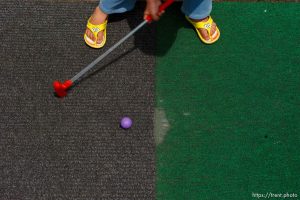 Kaysville - at Cherry Hill Tuesday June 9, 2009. 
Garrett Frazier and Ciera McFarland miniature golfing. mini golf. spongebob squarepants sandals