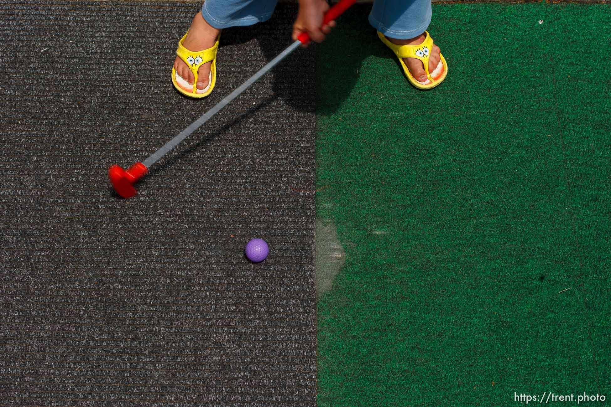 Kaysville - at Cherry Hill Tuesday June 9, 2009. 
Garrett Frazier and Ciera McFarland miniature golfing. mini golf. spongebob squarepants sandals