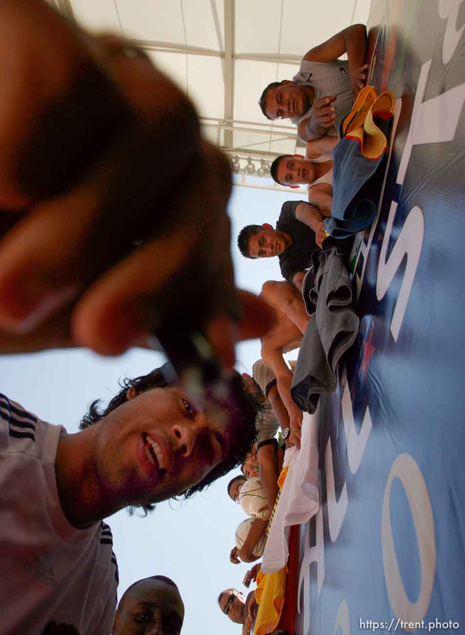 Sandy - Wilman Conde leans in to autograph the photographer's lens while signing jerseys for fans after a practice session for the MLS All-Stars team Tuesday, July 28, 2009 at Rio Tinto Stadium.
Trent Nelson/The Salt Lake Tribune; 7.28.2009