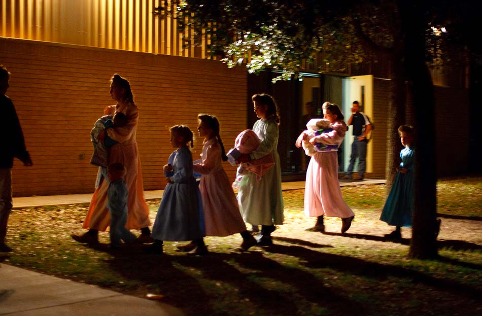 Eldorado, Texas - In April 2008, Child Protective Services (CPS) raided a polygamous sect's Texas ranch and removed 416 children after receiving phone calls, now believed to be a hoax, from someone claiming to be an abused sixteen-year-old girl. This raid on the FLDS Church's YFZ (Yearning for Zion) Ranch became the largest child custody case in United States history. Here, on the first night of removals, young FLDS women and children are taken into shelter at the First Baptist Church in Eldorado, Texas.