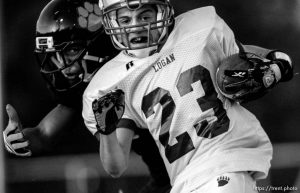 Trent Nelson  |  The Salt Lake Tribune Logan's Greg Vernier is brought down by Ogden's Denzel Swinton (rear). Ogden vs. Logan High School football Friday, September 18 2009 in Ogden.