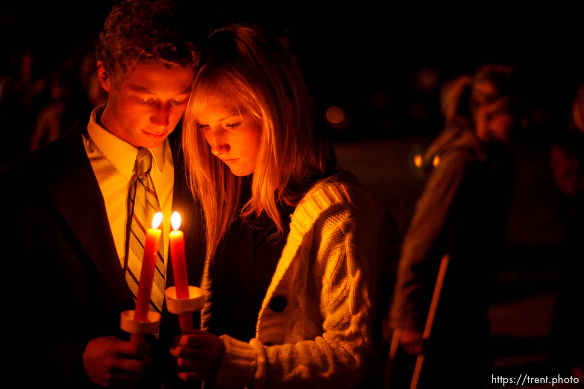 American Fork High School students Cree Anderson (left) and Cassedy Christensen hold candles during a vigil that followed a memorial service at American Fork High School Sunday, October 11 2009 to pay tribute to teacher Heather Christensen, who died in a bus crash after attempting to gain control of the bus.