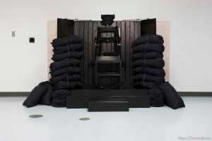 Trent Nelson  |  The Salt Lake Tribune Draper - The execution chamber at the Utah State Prison after Ronnie Lee Gardner was executed by firing squad Friday, June 18, 2010. Four bullet holes are visible in the wood panel behind the chair. Gardner was convicted of aggravated murder, a capital felony, in 1985.