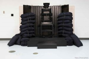 Trent Nelson  |  The Salt Lake Tribune Draper - The execution chamber at the Utah State Prison after Ronnie Lee Gardner was executed by firing squad Friday, June 18, 2010. Four bullet holes are visible in the wood panel behind the chair. Gardner was convicted of aggravated murder, a capital felony, in 1985.