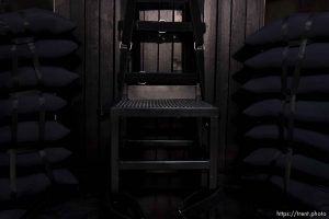 Trent Nelson  |  The Salt Lake Tribune Draper - The execution chamber at the Utah State Prison after Ronnie Lee Gardner was executed by firing squad Friday, June 18, 2010. Four bullet holes are visible in the wood panel behind the chair. Gardner was convicted of aggravated murder, a capital felony, in 1985.