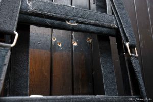 Trent Nelson  |  The Salt Lake Tribune Draper - The execution chamber at the Utah State Prison after Ronnie Lee Gardner was executed by firing squad Friday, June 18, 2010. Four bullet holes are visible in the wood panel behind the chair. Gardner was convicted of aggravated murder, a capital felony, in 1985.