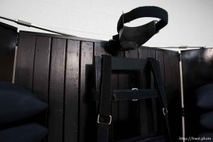 Trent Nelson  |  The Salt Lake Tribune Draper - The execution chamber at the Utah State Prison after Ronnie Lee Gardner was executed by firing squad Friday, June 18, 2010. Four bullet holes are visible in the wood panel behind the chair. Gardner was convicted of aggravated murder, a capital felony, in 1985.