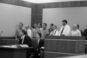 Trent Nelson  |  The Salt Lake Tribune In the gallery, people stand to show honor and respect to Warren Jeffs, leader of the FLDS Church, appeared before Judge Terry Christiansen in Third District Court  Tuesday, September 7, 2010 in West Jordan, Utah. guy nielsen, wendell nielsen, mosiah jeffs, john wayman, merril jessop, willie jessop, vaughan taylor. back row gary batchelor and heidi mattingly foster