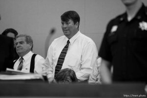 Trent Nelson  |  The Salt Lake Tribune Followers of polygamist leader Warren Jeffs (Merril Jessop at left, Willie Jessop at center) stand as he is led out of the courtroom. Jeffs, the leader of the FLDS Church, appeared before Judge Terry Christiansen in Third District Court Tuesday, September 7, 2010 in West Jordan, Utah.