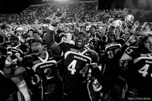 Trent Nelson  |  The Salt Lake Tribune Utah State's Devin Johnson (44) and the rest of the team celebrate their victory over BYU with the Utah State fight song. Utah State vs. BYU college football in Logan Friday, October 1, 2010.