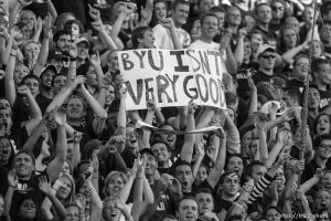 Trent Nelson  |  The Salt Lake Tribune Utah State fans holding a sign reading, 
