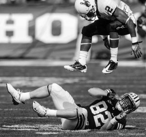 Trent Nelson  |  The Salt Lake Tribune Wyoming's Marcell Gipson flies over BYU tight end Mike Muehlmann (82), who had just dropped a pass in the second quarter. BYU vs. Wyoming, college football Saturday, October 23, 2010 at LaVell Edwards Stadium in Provo.