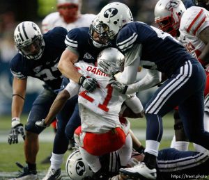Trent Nelson  |  The Salt Lake Tribune BYU defensive lineman Vic So'oto (37), BYU defensive back Zeke Mendenhall (30) and BYU linebacker Kyle Van Noy (45) bring down New Mexico's Kasey Carrier during the first half,  BYU vs. New Mexico, Saturday, November 20, 2010.