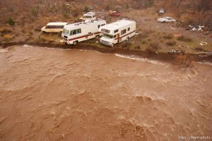 Trent Nelson  |  The Salt Lake Tribune Recreational vehicles in a precarious position on the edge of Beaver Dam Wash in Motoqua, Utah, Wednesday, December 22, 2010.