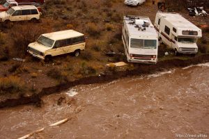 Trent Nelson  |  The Salt Lake Tribune Recreational vehicles in a precarious position on the edge of Beaver Dam Wash in Motoqua, Utah, Wednesday, December 22, 2010.