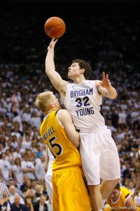 Trent Nelson  |  The Salt Lake Tribune BYU's Jimmer Fredette shoots over Wyoming's Adam Waddell as BYU hosts Wyoming, college basketball in Provo, Utah, Saturday, March 5, 2011.