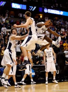 BYU's Jimmer Fredette, Kyle Collinsworth and Charles Abouo celebrate as BYU defeats Gonzaga in the NCAA Tournament, men's college basketball at the Pepsi Center in Denver, Colorado, Saturday, March 19, 2011, earning a trip to the Sweet 16.