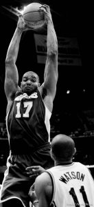 Los Angeles Lakers center Andrew Bynum pulls down a rebound over Utah Jazz guard Earl Watson as the Utah Jazz host the Los Angeles Lakers, NBA basketball in Salt Lake City, Utah, Friday, April 1, 2011. at left, Los Angeles Lakers forward/center Pau Gasol.