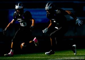 Trent Nelson  |  The Salt Lake Tribune
Riverton's Joey Jensen, left, and Tupou Tua'one Aagard chase down a fumble by Herriman's Tueni Lupeamanu. Herriman vs. Riverton High School football at Rice-Eccles Stadium in Salt Lake City, Utah, Saturday, August 27, 2011.
