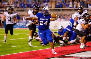 Trent Nelson  |  The Salt Lake Tribune Bingham's Daniel Palepoi scores on a short run during the third quarter. Bingham vs. Alta High School football at Rice-Eccles Stadium in Salt Lake City, Utah, Saturday, August 27, 2011.