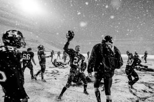 Trent Nelson  |  The Salt Lake Tribune Hurricane's Tyson Long (24) and teammates celebrate in the snow after they defeated Desert Hills 21-0 in the 3A State Championship high school football game at Rice-Eccles Stadium in Salt Lake City, Utah, Friday, November 18, 2011.
