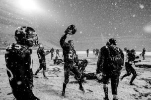 Trent Nelson  |  The Salt Lake Tribune Hurricane's Tyson Long (24) and teammates celebrate in the snow after they defeated Desert Hills 21-0 in the 3A State Championship high school football game at Rice-Eccles Stadium in Salt Lake City, Utah, Friday, November 18, 2011.
