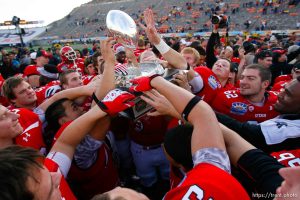 Trent Nelson  |  The Salt Lake Tribune Utah players celebrate with the trophy as the University of Utah defeated Georgia Tech, college football at the Sun Bowl in El Paso, Texas, Saturday, December 31, 2011.