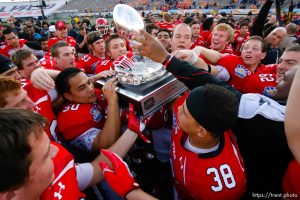 Trent Nelson  |  The Salt Lake Tribune Utah players celebrate with the trophy as the University of Utah defeated Georgia Tech, college football at the Sun Bowl in El Paso, Texas, Saturday, December 31, 2011.
